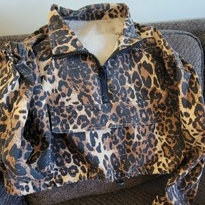 Half jacket with draw string waist and half zip and faux pocket. Sz sm to med.